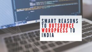 Laptop screen with code editor and text overlay reading "Smart Reasons to Outsource WordPress to India