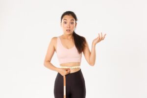 A woman celebrating weight loss