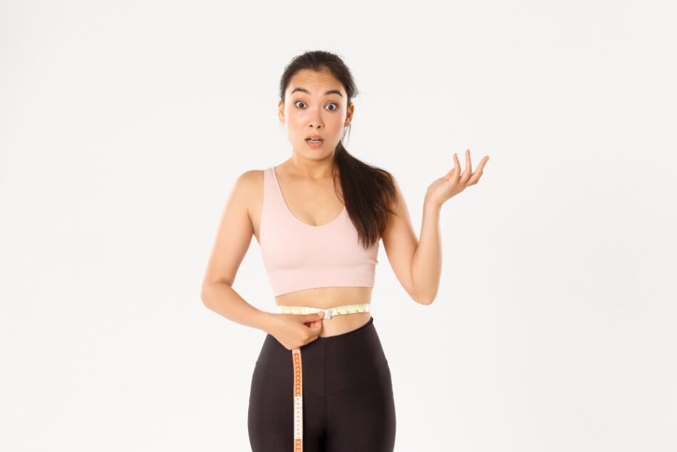 A woman celebrating weight loss