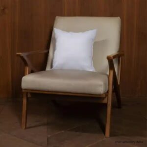 Modern wooden armchair with light beige sofa upholstery and white cushion