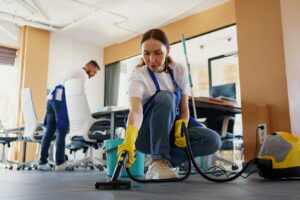 Professional cleaners performing Commercial & Residential Hassle-Free Cleaning services in a modern office space.
