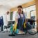 Professional cleaners performing Commercial & Residential Hassle-Free Cleaning services in a modern office space.