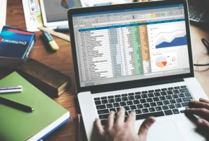 An employee checking accounts record in laptop