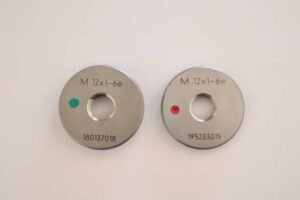Metric thread gauge used for precision thread inspection in manufacturing applications, highlighting quality control and accurate threaded component verification.
