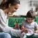 Busy working parents booking a nanny consultation in Dubai before hiring a professional caregiver