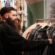 close up man looking leather jacket rail