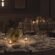 Candlelit round reception tables with white linens, floral centerpieces and dark Chiavari-style chairs at Hotel Viking, a wedding venue in Newport, RI