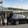 JFK airport transfers: a chauffeur loading luggage into a black luxury SUV for travelers at JFK Airport Terminal 4